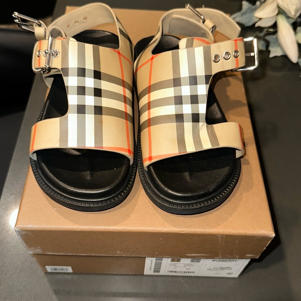 As is . Burberry sandals . Small mark on the front